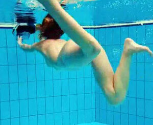Porno shooting underwater. Naked Teenager peels off off her