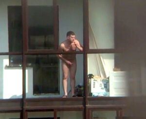Bare guy on the balcony in spy hidden cam movie