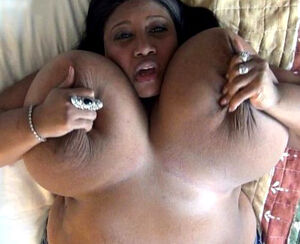 Large ebony doll Cotton Candy wiggling her Large hooters